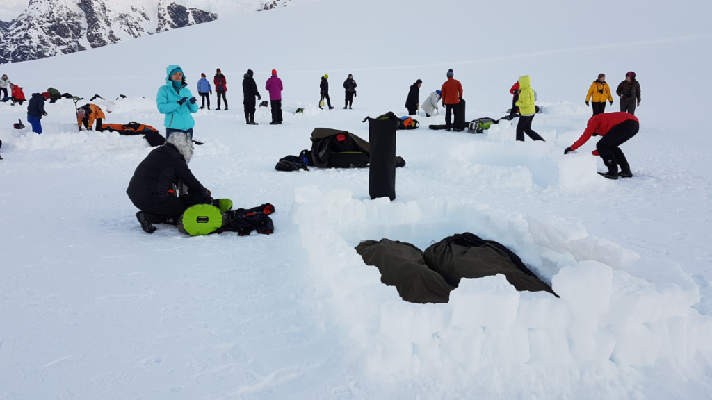 A group of people preparing to camp in Antarctica